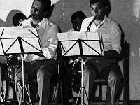 198x-54  22 lipca 1983  Jawor, Teatr Miejski  Koncert z okazji Święta Odrodzenia      Pierwszy występ "Big Band JOK" pod kierownictwem Stanisława Duszeńko  Pierwszy rząd, od lewej: Stanisław Duszeńko (saksofon tenorowy), Bogdan Migłowiec (saksofon tenorowy)