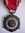 (il. 6) srebrny medal Siły Zbrojne w Służbie Ojczyzny